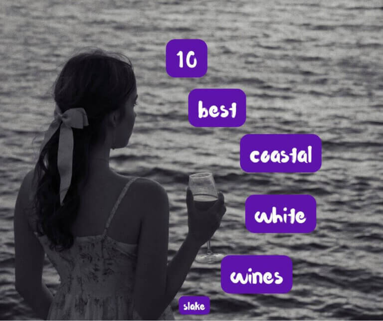 woman holding wine glass looking out to sea, with the words 10 best coastal white wines overlaid.